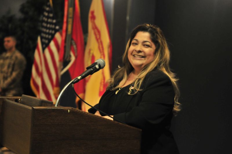Dr. Gina Di Nola teaching military personnel in a classroom